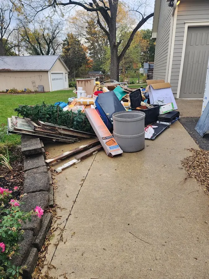 Dumpster being loaded with debris for Estate Cleanout Dumpster Rental in Morris